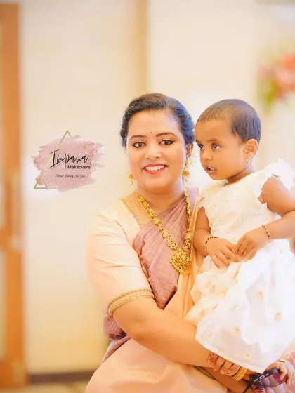 A heartwarming photo of a mother and her child. Her makeup is soft and natural, perfect for enjoying the family function.