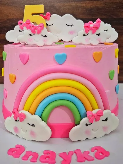 The matching rainbow and cloud cake for Anayka's 5th birthday, this one in a chocolate truffle flavor. I love making coordinated cakes for siblings!