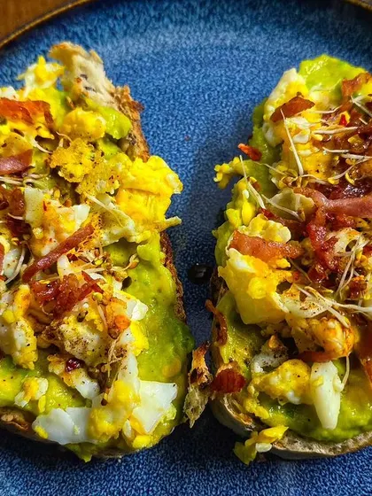Today's breakfast is avocado toast with scrambled eggs and bacon. Using fresh ingredients from the garden makes every meal special.