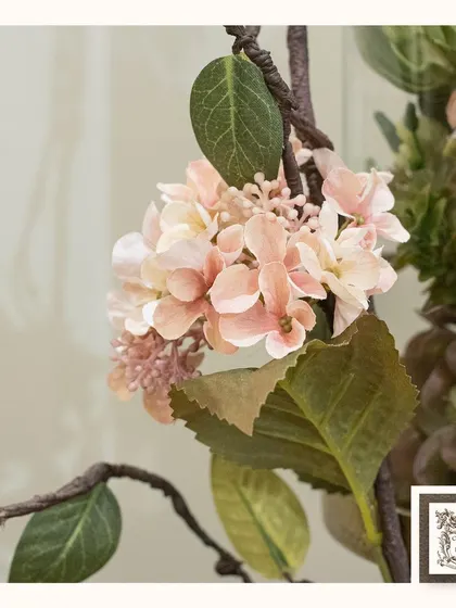 A close-up of the delicate pink hydrangea in one of my nature-inspired arrangements. The realistic texture and color bring a maintenance-free touch of nature to your home.