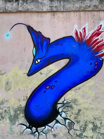 I wanted to overcome my fear of painting characters, so I created this sea monster for a graffiti jam in Khan Market. I'm happy with how this first attempt turned out.