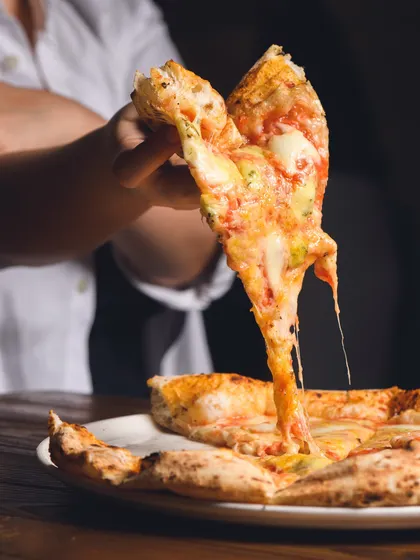 One slice equals endless happiness. This epic cheese pull from our Quattro Formaggi pizza is proof.