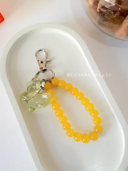 Sunshine in a charm. This yellow beaded butterfly charm is bright, cheerful, and guaranteed to make you smile.