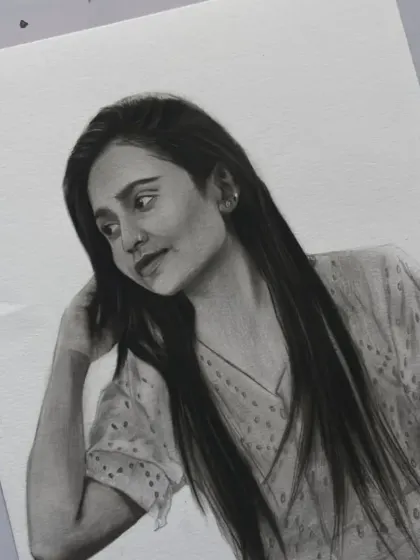 A close-up of the finished sketch, focusing on her expression and the detailed work on her hair.