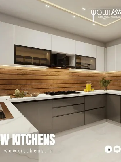 This angle highlights the seamless sink and countertop area, along with the smoked glass upper cabinets that add depth and display space without creating clutter.