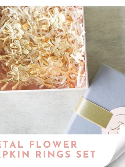 A set of delicate metal flower napkin rings, presented in a beautiful gift box. These are a lovely and thoughtful gift for someone who enjoys hosting.