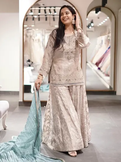Beautifully textured, exquisitely designed. This elegant brocade sharara suit is for a refined and sophisticated style.