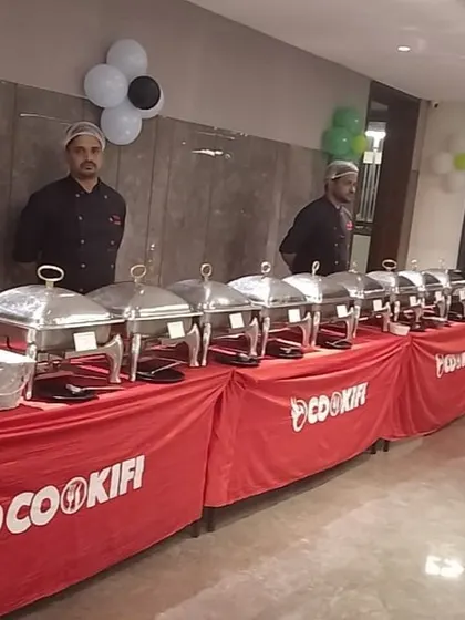 A professional and clean buffet setup for a house party, with our staff ready to assist guests.