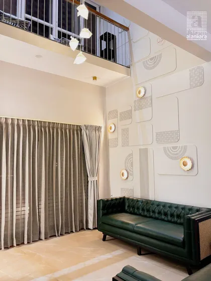A wider perspective of the double-height living room, showing how I balance grand architectural features with comfortable, luxurious furnishings to create a space that is both impressive and livable.