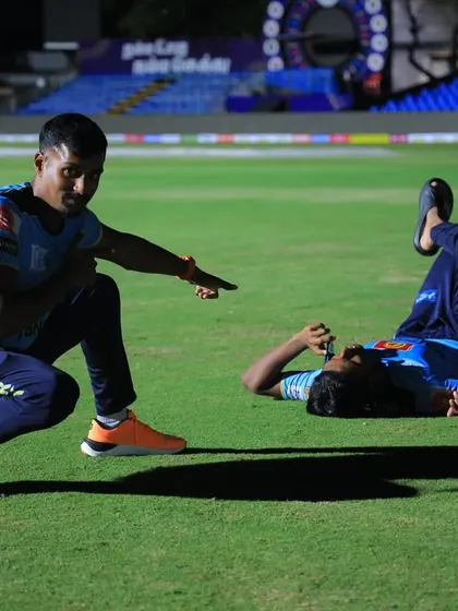 A candid moment on the field after a tough session. My training pushes athletes to their limits, but we always make time for recovery and a bit of fun.