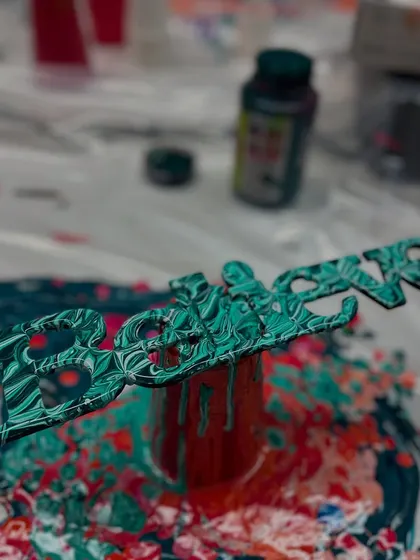 We also use fluid art techniques on different objects, like this wooden "Believe" sign. It turns a simple object into a unique piece of decor.