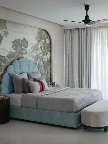 A full view of the daughter's bedroom, showing the arched wallpaper panel and the elegant grey curtains. The space is a perfect mix of bold design choices and serene, comfortable elements.