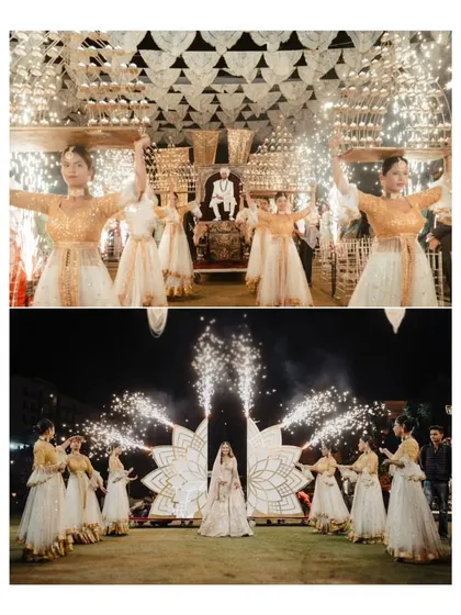 The grand, dramatic entrances of both the bride and groom, complete with dancers and sparklers, for their Varmala ceremony.