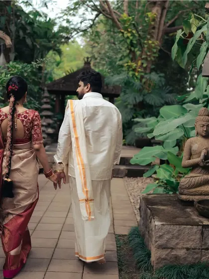 Walking away together, hand in hand. This classic post-wedding shot symbolizes the beginning of their shared path in life.