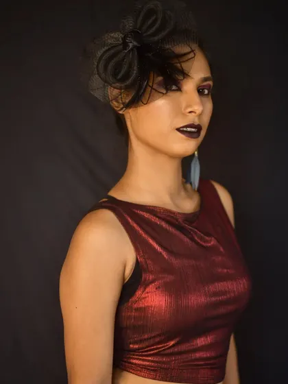 This look is all about attitude. The dark lipstick and bold eyes create a strong, editorial feel perfect for a photoshoot.