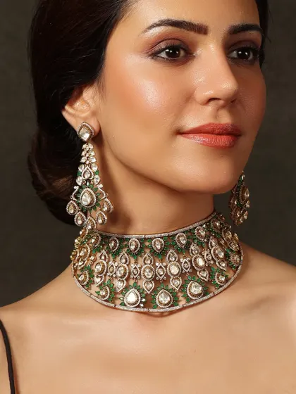 An elegant choker and earring set from our Emrosia collection, featuring a unique design of polki diamonds set against a backdrop of green beads.