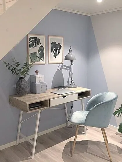 Here, we used a simple diagonal colour block to create a distinct and stylish study nook under a staircase. It's a smart, budget-friendly way to visually separate a space for a specific function.