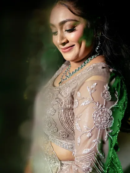 Sangeet glam that speaks grace. This candid shot captures the dewy skin and glitter kissed eyes, perfect for a festive vibe.