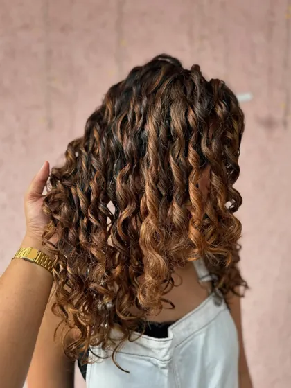A side view of the caramel kissed curls. The color is so rich and beautiful. (No filter)
