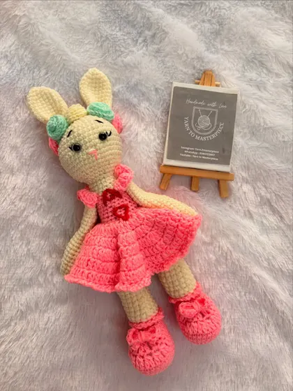 This custom doll was made for a special little one, featuring a pink dress with a personalized initial 'A' on it. I love bringing your unique ideas to life.