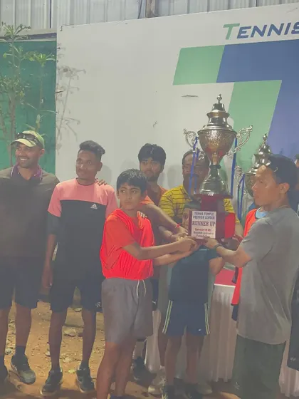 A duplicate shot of the winning team from the TTPL in December 2022 posing with the grand trophy. This picture captures the pride and accomplishment of a successful league campaign.