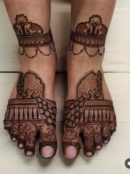 Your feet deserve just as much attention. This elegant foot mehndi showcases my skill with symmetrical patterns, featuring graceful peacocks and royal elephants, perfect for completing your bridal henna.