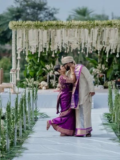 A beautiful moment on a floating mandap. The unique venue and the couple's connection create a truly magical and unforgettable wedding portrait.