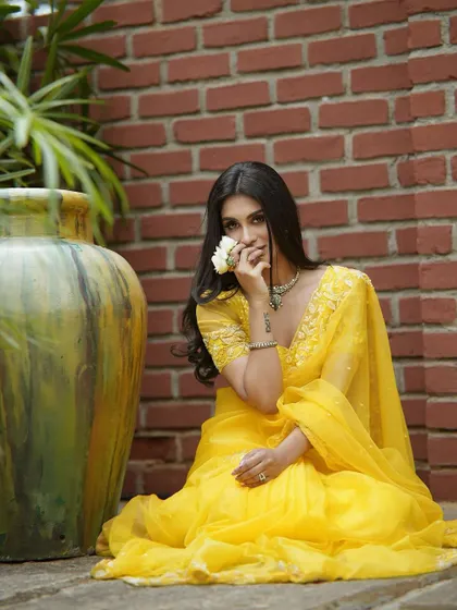 Another angle of the yellow organza saree, perfect for a garden party or festive event.