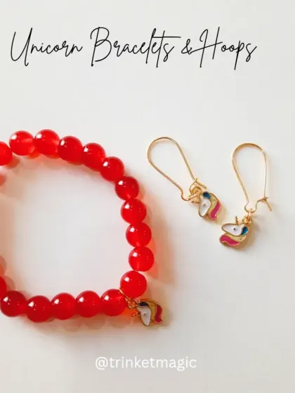 The unicorn bracelet and hoop set in a vibrant red. The glossy red beads contrast beautifully with the magical unicorn charm.