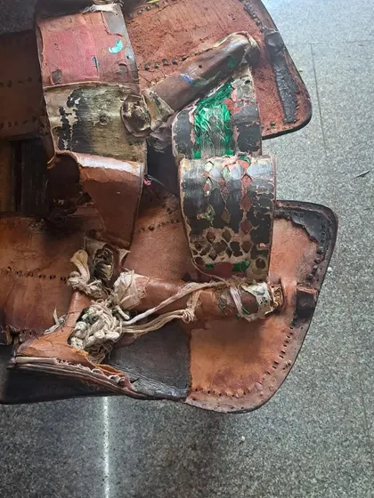 The old, worn out padukas that are replaced annually during the temple's jatre.