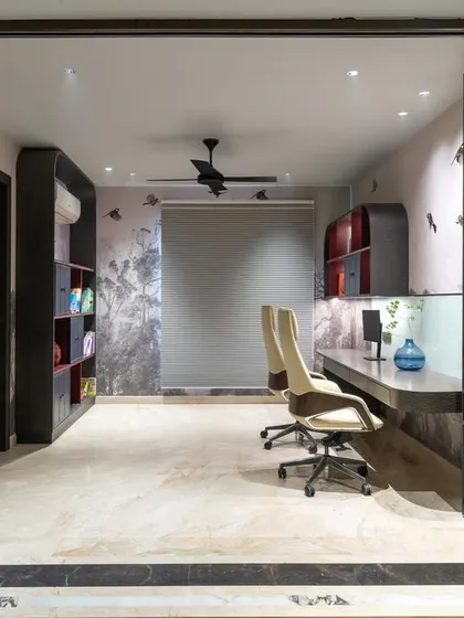 Another angle of the home office, showing the dual-person workstation and the elegant, fluted glass sliding doors that separate the space. The design is both functional and aesthetically pleasing.