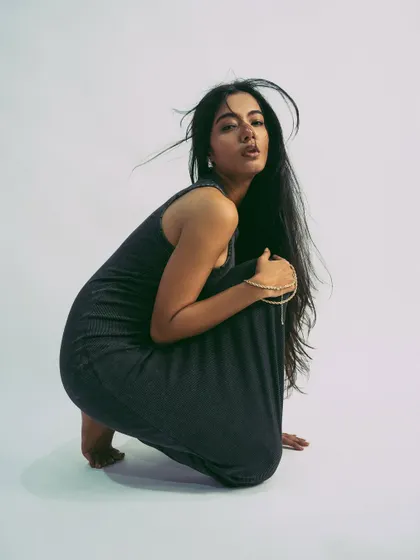 A strong, crouching pose that is both grounded and full of potential energy.