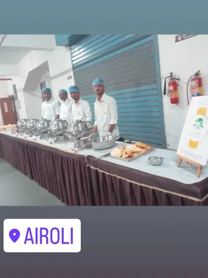 A simple and clean buffet setup with our team ready to serve in Airoli. Our branding is also displayed so guests know who is serving them.
