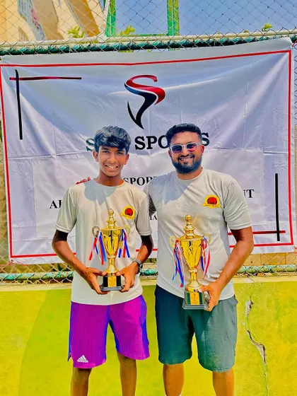 Coach Mohit Mayur Jayaprakash, himself a former pro, celebrating his win at the AITA 1 Lakh tournament after coming through qualifying, showcasing his experience and fighting spirit.
