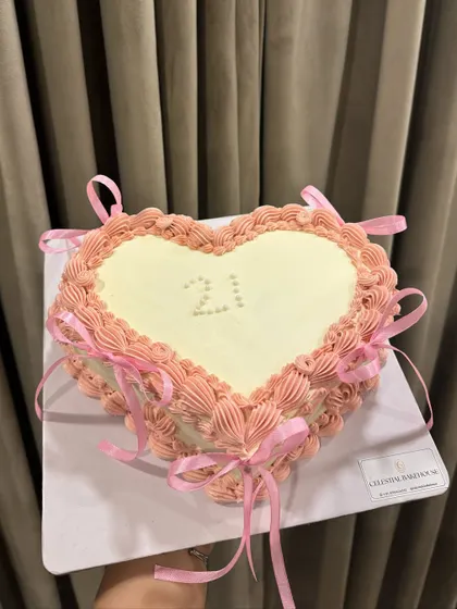 Our vintage heart cake, ready for a 21st birthday celebration. The edible pearls spelling out "21" add a personal and delicate touch.