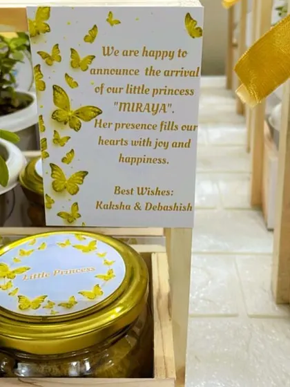 It's all in the details. This close-up shows the personalized announcement card for baby Miraya, featuring a beautiful butterfly theme that coordinates with the entire gift basket. I can customize every element to match your vision.