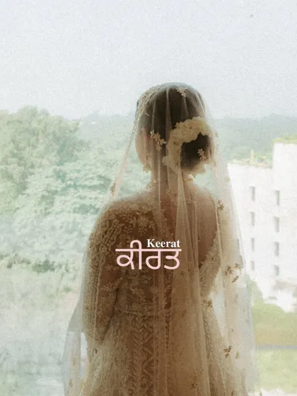 A stunning and anonymous portrait of the bride Keerat, looking out a window with her name beautifully written in Punjabi. A very personal and artistic shot.