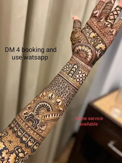 A full-arm design with a mix of modern geometric and traditional floral patterns. I am available for booking via WhatsApp and offer home service.