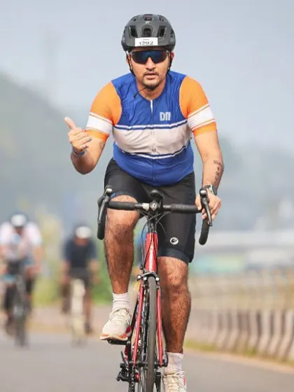 An athlete powering through the cycling leg of the Ironman 70.3. We provide specialized training for triathletes aiming for these endurance events.