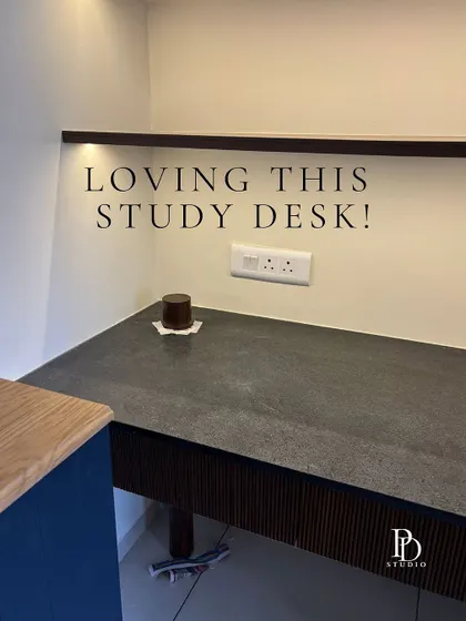 A site visit snapshot of a study desk being installed. The leather-finish granite top is in place, and the fluted details on the side are coming together.