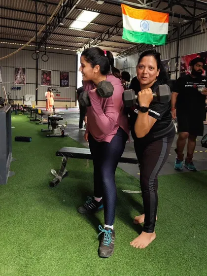 Two of our members working on their dumbbell curls. It's great to see the focus and determination as they build their upper body strength together.