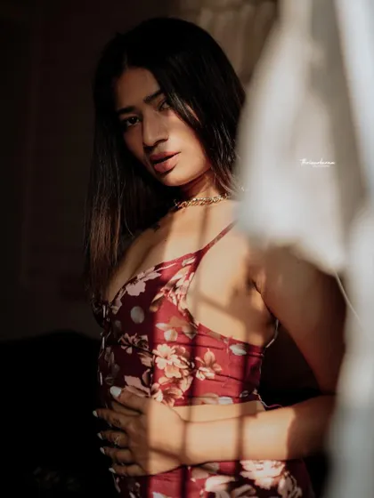 This shot is all about the mood. The soft light, the pose, and the expression come together to create a sensual and artistic image.