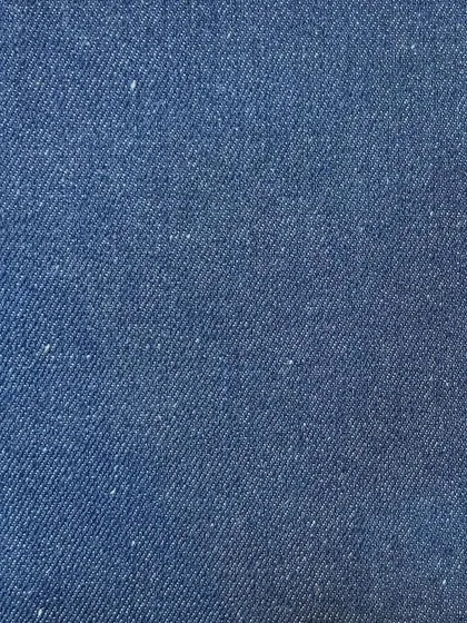 The rich texture of a medium-blue rigid denim. This is the perfect starting point for a timeless pair of custom-fit jeans.