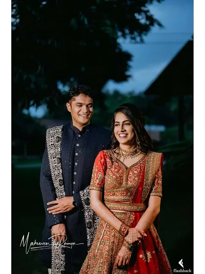 The couple looking elegant against the evening sky.