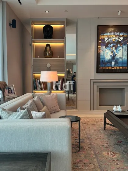 Nestled in the heart of Gurugram, this living room embodies a serene blend of muted greys and earthy brown furnishings. We introduced vibrant decor accents and artwork to add touches of personality, transforming the space into a plush haven of luxury and tranquility.