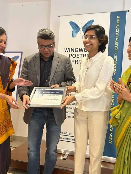 Deepak Ahuja, a regional prize winner, is honored at the award ceremony.