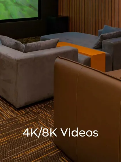 Every detail matters in a custom home theater. This series of shots highlights the clean lines of the ceiling lighting, the texture of the wood-paneled acoustic walls, and the high-quality finish of the leather recliner seats, all contributing to a premium experience.