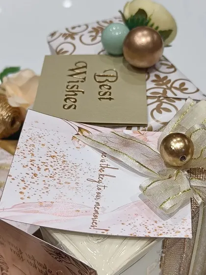 A little something to celebrate a big day. This beautifully wrapped gift is perfect for an engagement or anniversary, designed to hold cherished memories.