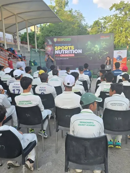 An interactive nutrition workshop in progress. Players learn about the importance of a balanced diet for energy, recovery, and injury prevention from certified sports nutritionists.