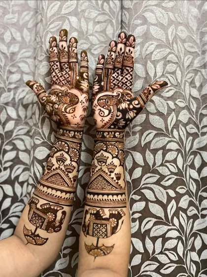 A classic full-arm design featuring elephants in a procession, a symbol of royalty and celebration in Indian weddings.